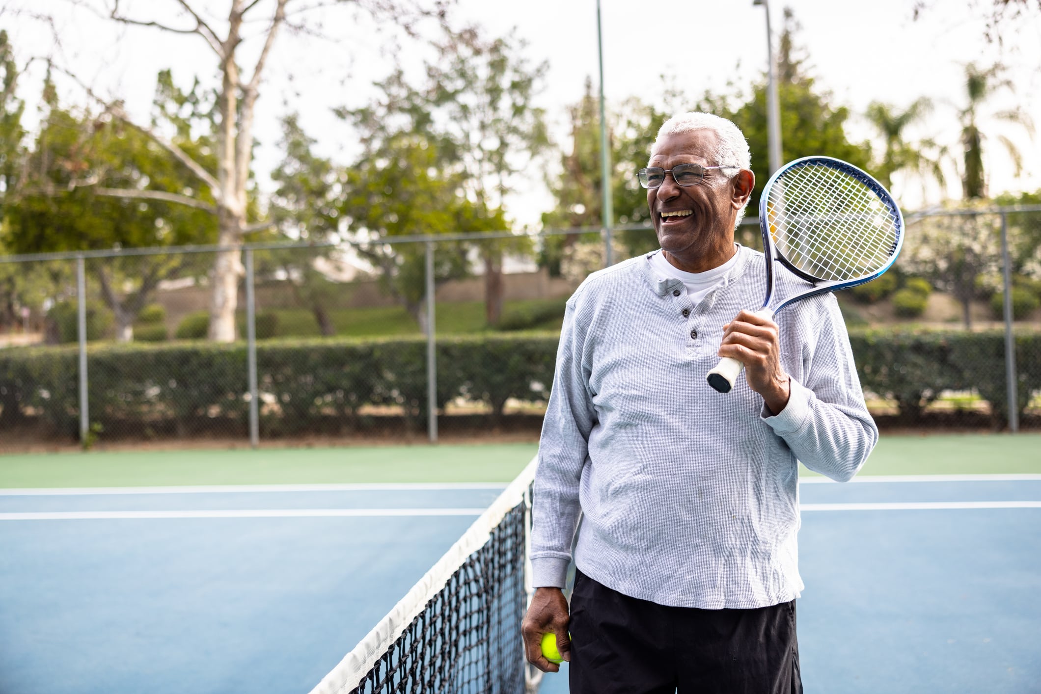 Portrait of a senior black man on the tennis court