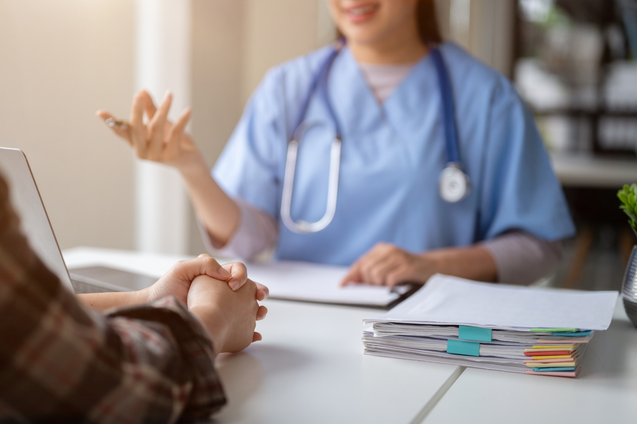 Close up hand image of a serious patient having a medical consultation with a doctor