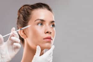 Woman receiving cosmetic facial injection