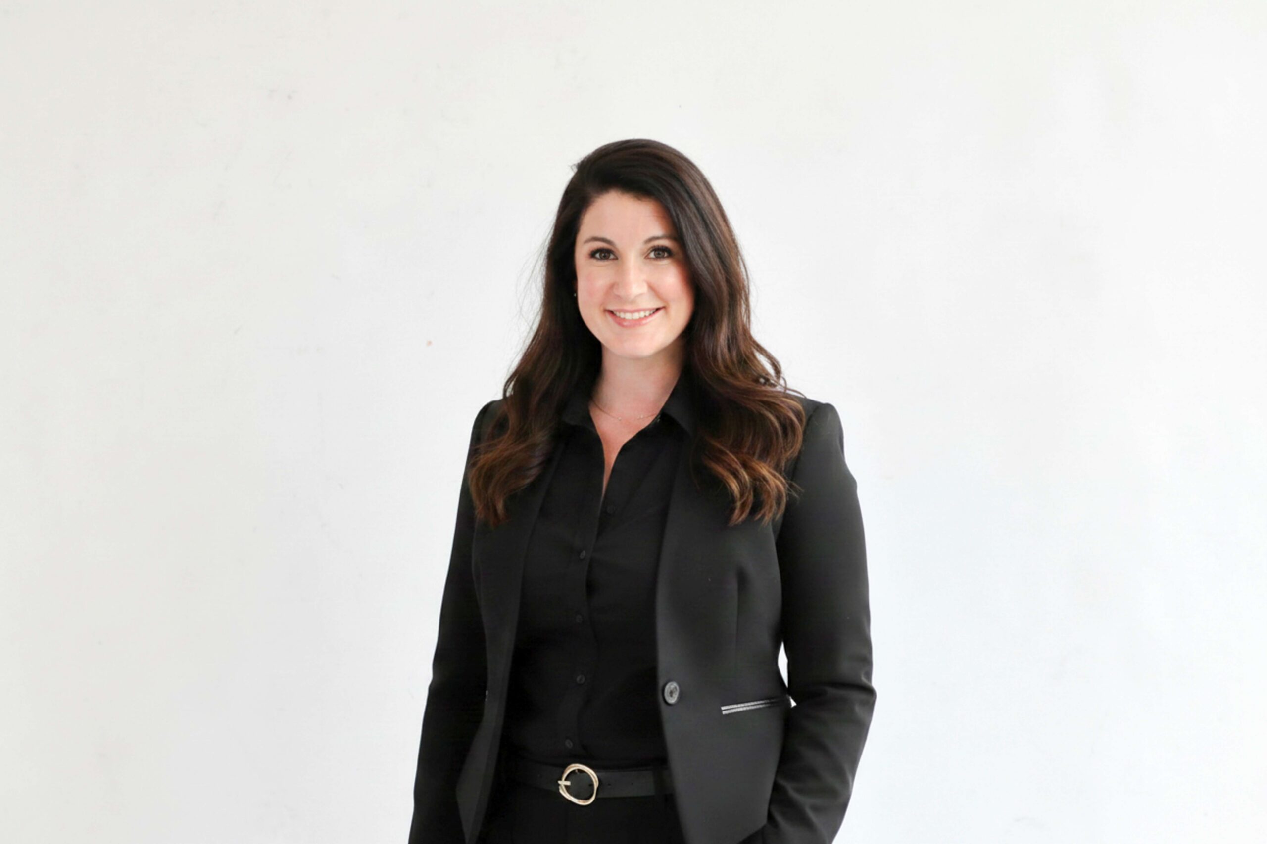 Portrait of smiling woman in black blazer